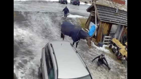 Person struggles to walk on slippery ground in Sweden