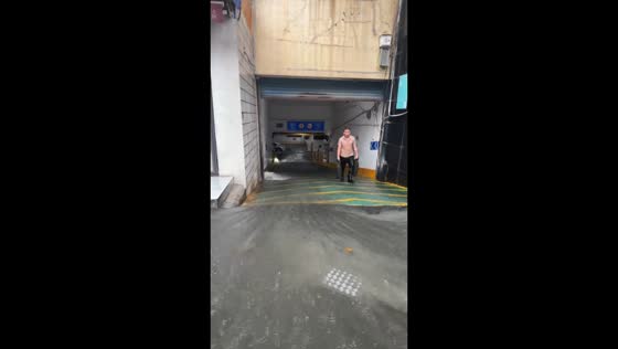 Floodwater flows into underground parking garage in Jiangsu, China