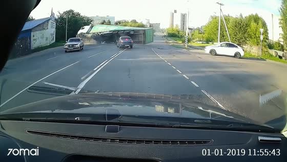 Truck overturns after collision with car at intersection in Tikhvin, Russia