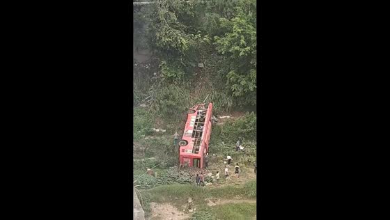 Bus overturns off elevated roadway after crash in Wuzhou, China