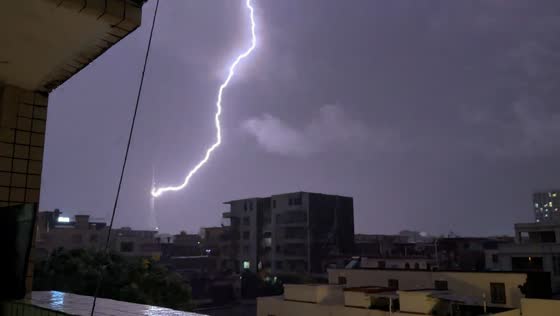 Lightning strikes and lingers on tower during storm in Guangdong, China