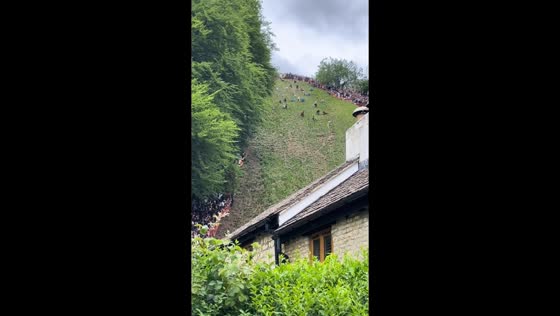 Spectacular tumbles at Cooper's Hill Cheese-Rolling event in England, UK