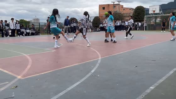 Futsal player accidentally gets hit in the face by the ball in Bogotá, Colombia