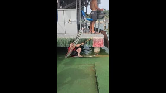 Man loses balance while preparing for water skiing in Zalishchyky, Ukraine