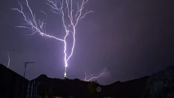 Multiple lightning bolts illuminate night sky over Makkah, Saudi Arabia