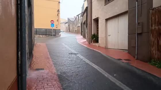 Heavy rainfall floods streets during an intense evening downpour in Tarragona, Spain
