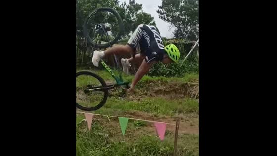 Bicyclist falls after navigating raised plank in Calinog, Philippines