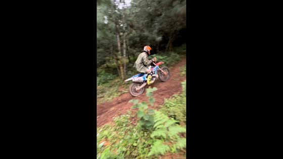 Motocross rider loses control on hill in Yunnan, China