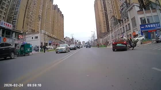 Motorcycle and car collide at intersection in Sichuan, China
