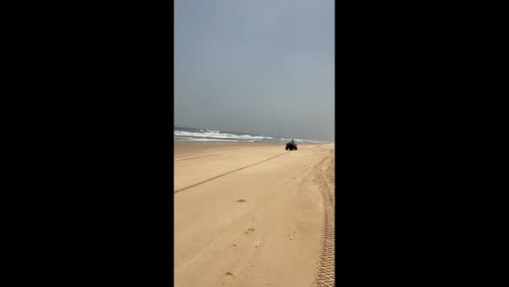 Rider falls while drifting quad bike on beach in Saly, Senegal