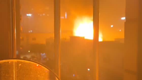 Fire with explosions erupts in outdoor parking lot in Guangzhou, China