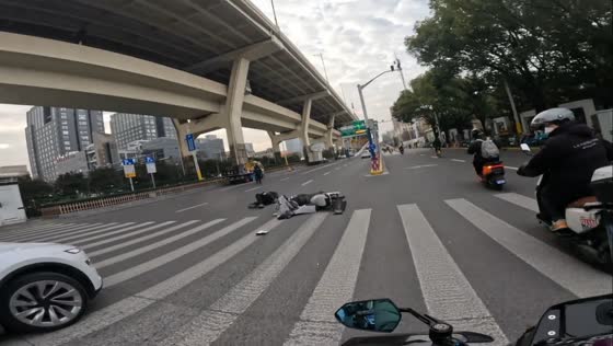Motorcycle struck by car during turn in Shanghai, China
