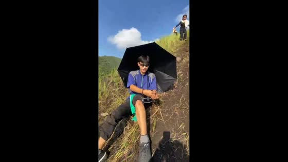 Sister slips on mountain slope and knocks brother over in Sultan Kudarat, Philippines