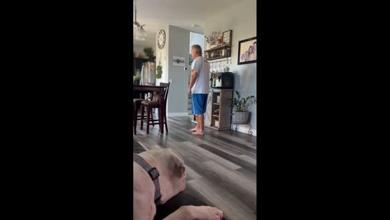 Man playfully teases dog inside home in Gilbert, Arizona, USA