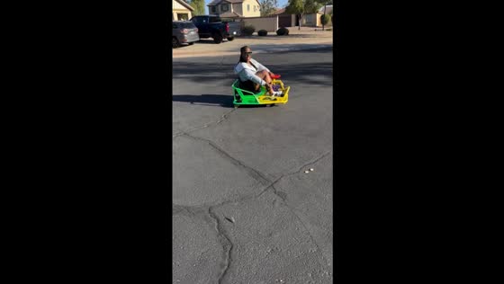 Drift kart mishap: lady takes a tumble uphill