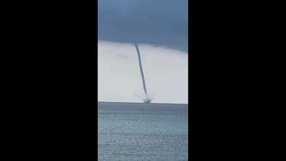 Waterspout forms off the coast in Ouranoupoli, Halkidiki, Greece
