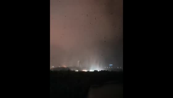 Powerful wedge tornado moves through Huanggang under stormy night skies in Hubei, China