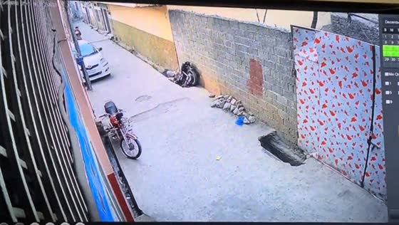 Motorcyclist loses balance and falls into an open drain in Swat, Pakistan