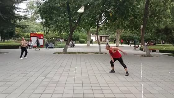 Old men passing sandbags for workout in Hebei, China