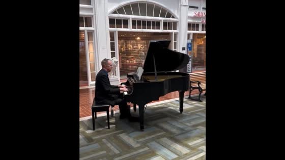 Piano player performs during evacuation at Savannah-Hilton Head International Airport