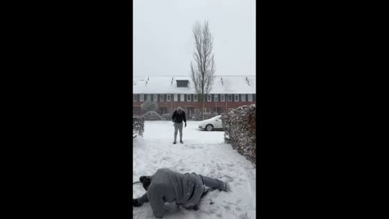 Snowball mishap during playful snow day in Holland, Netherlands