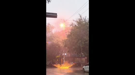 Electrical tower sparks and heavy rain captured during storm in Shandong, China