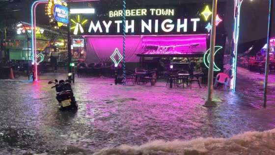 Heavy flooding turns Pattaya nightlife street into a river in Chonburi, Thailand