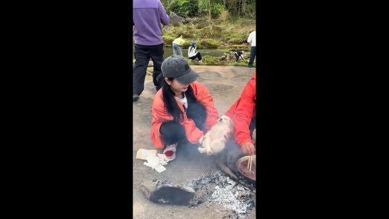 Puppy tumbles into river and naps by fire in Sichuan, China