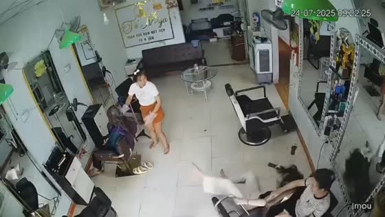 Woman spins off salon chair in playful mishap in Hanoi, Vietnam