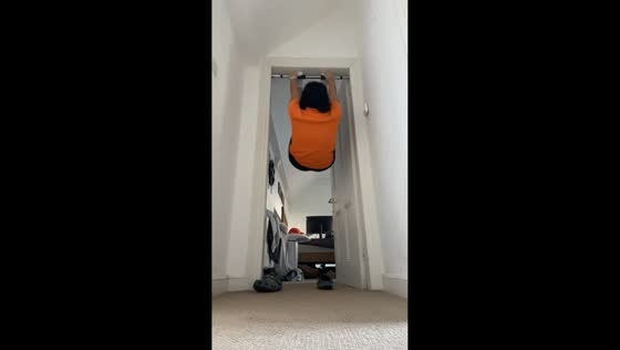 Woman falls while attempting a foot hang from a pull-up bar in Cork City, Ireland