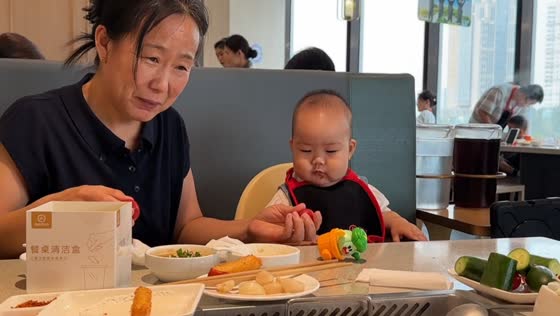 Toddler adorably makes a sour face after tasting a cherry tomato in Hebei, China