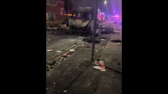 Aftermath of far-right riot in Southport: burnt vehicle and trash-littered streets