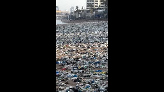 Monsoon tides wash tonnes of plastic waste onto Juhu Beach in Mumbai, India
