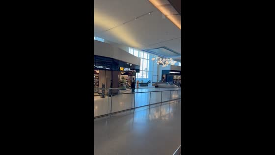 Travelers unfazed during fire alarm at San Diego International Airport, California, USA