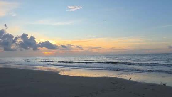 Peaceful sunrise with rolling waves in Hilton Head, South Carolina
