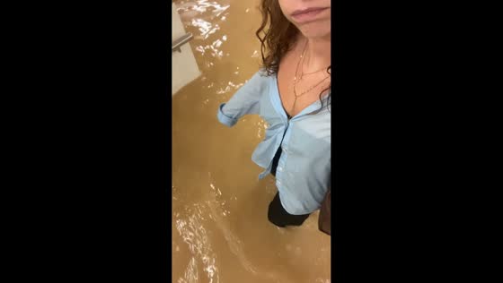 Torrential rain floods metro as passengers wade through deep water in Valencia, Spain