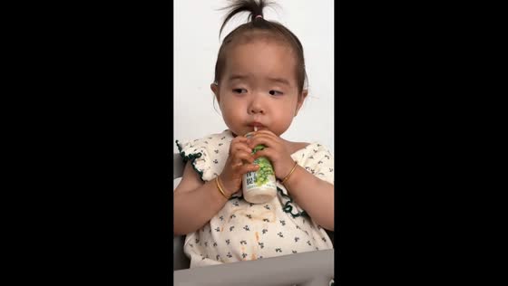 Sleepy toddler drops bottle while drinking in Shandong, China
