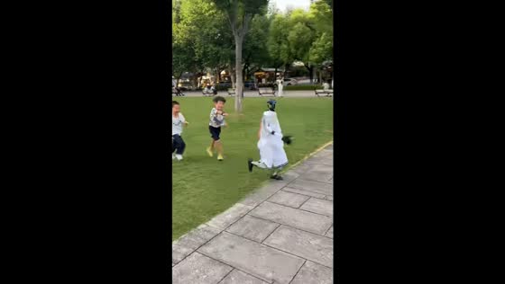Children play tag with robot in Hangzhou, Zhejiang, China