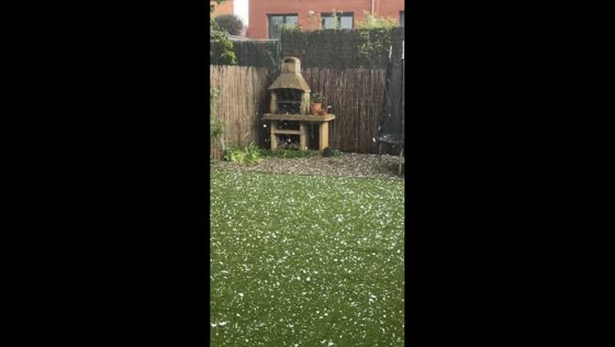 Hailstorm batters backyard during severe weather in Vic, Spain
