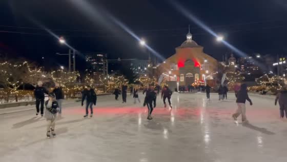 Outdoor skating rink bustling with activity at Lansdowne Park in Ottawa, Canada