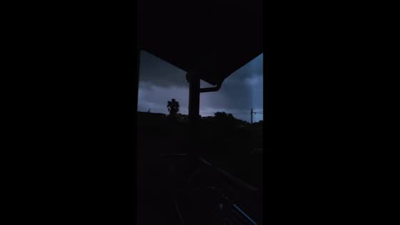 Dark thunderclouds and lightning loom over Agrigento during severe weather in Sicily, Italy