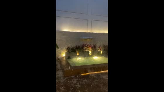 Severe hailstorm blankets a residential yard in Asuncion, Paraguay