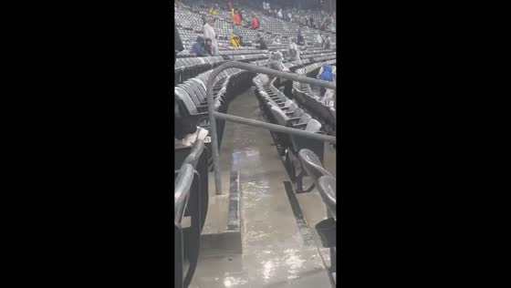 Heavy rain floods stadium aisles during Browns vs. Jets game at MetLife Stadium, New Jersey, USA