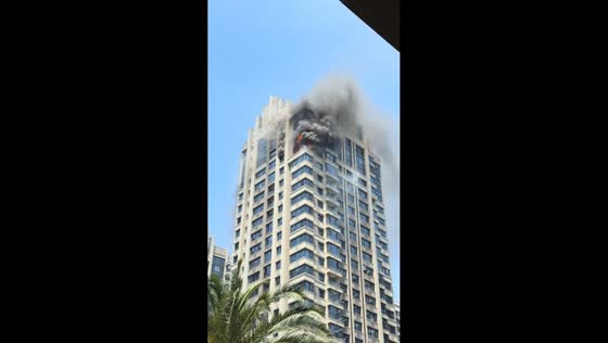 Fire breaks out at high-rise residential tower in Zhejiang, China