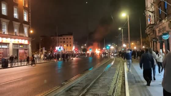 Violent unrest erupts in Dublin following stabbing: protesters set Garda car and bus ablaze in O'Connell Street