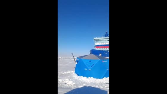 Icebreaker narrowly misses sleeping fisherman on frozen Yenisei River in Krasnoyarsk, Russia