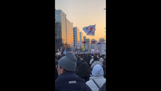 Crowds celebrate President Yoon Suk Yeol's impeachment in Seoul, South Korea