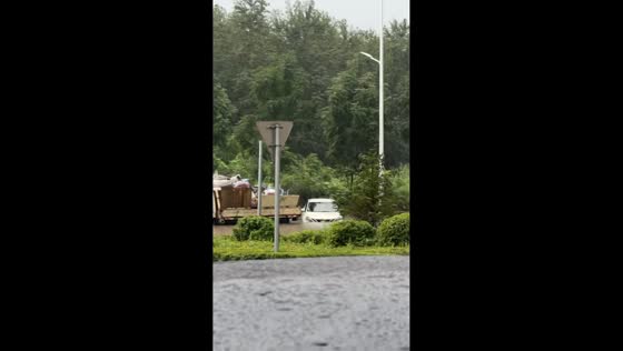 Vehicles stranded and submerged by severe flooding on road in Heilongjiang, China