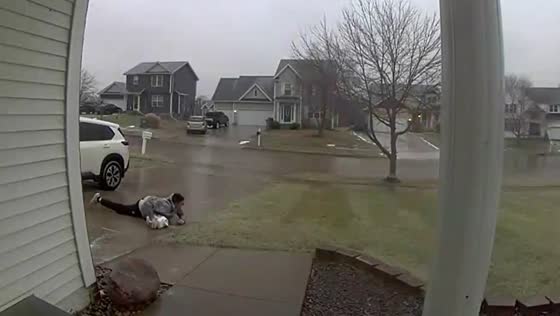 Person slides on the ground in Des Moines, Iowa, USA
