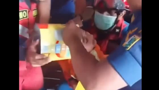 Jakarta firefighters remove metal can stuck on child's head